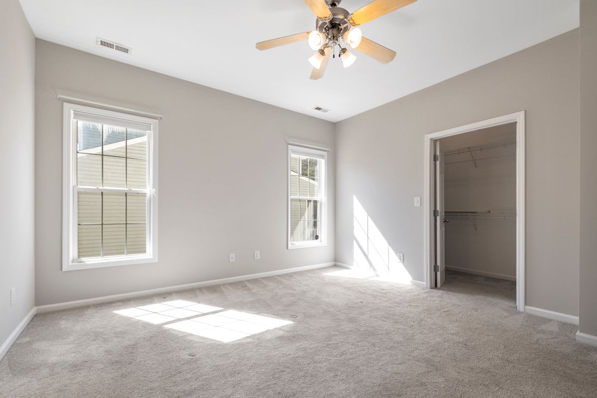 Empty rental room with freshly cleaned carpet